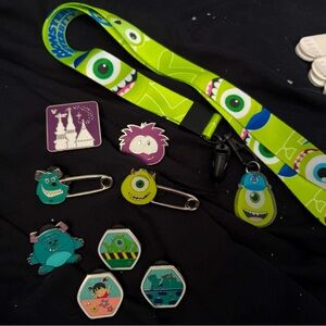 Lot of 8 Disney pins and lanyard Monsters Inc